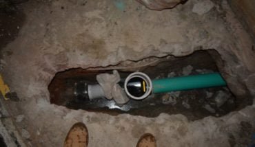 Backwater valve installation under the basement in residental property