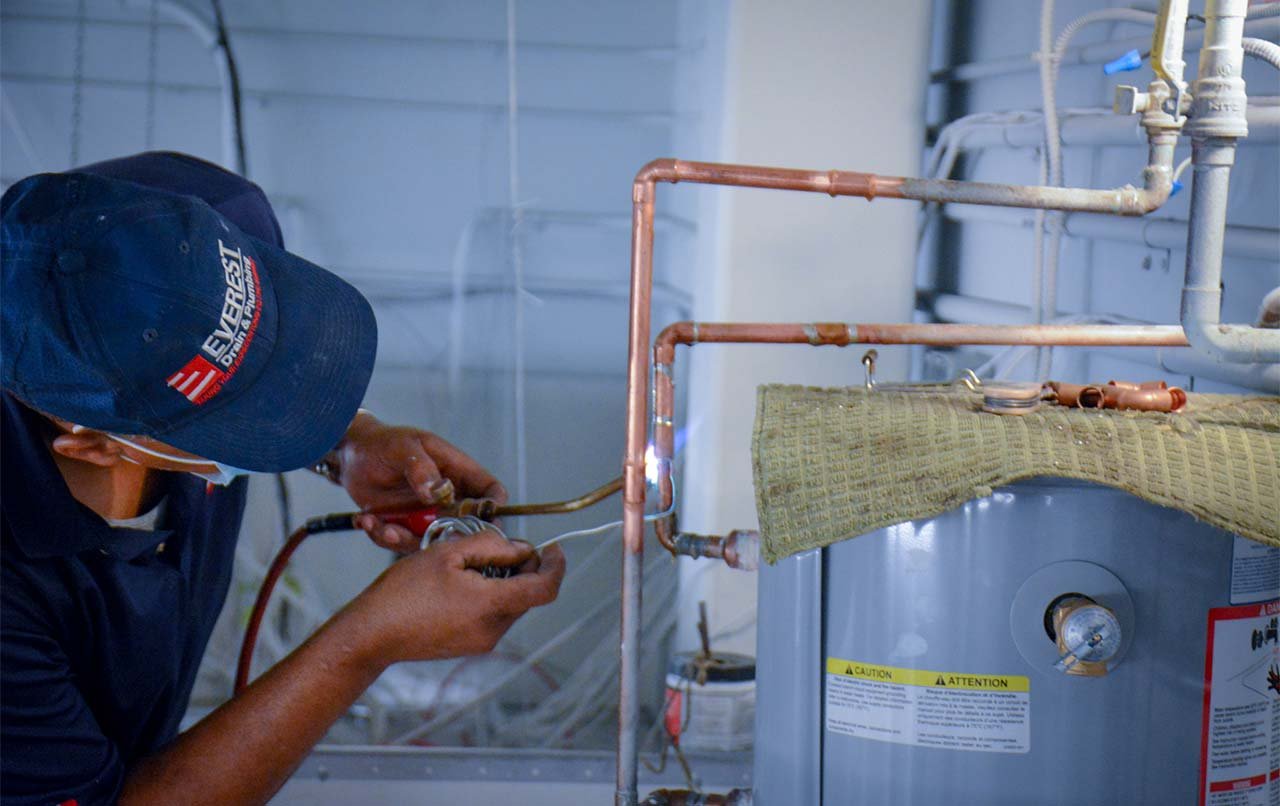 repairing hot water heat by everest prof. plumber
