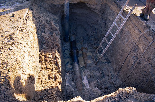 exposed underground water main break 8 inch water line 