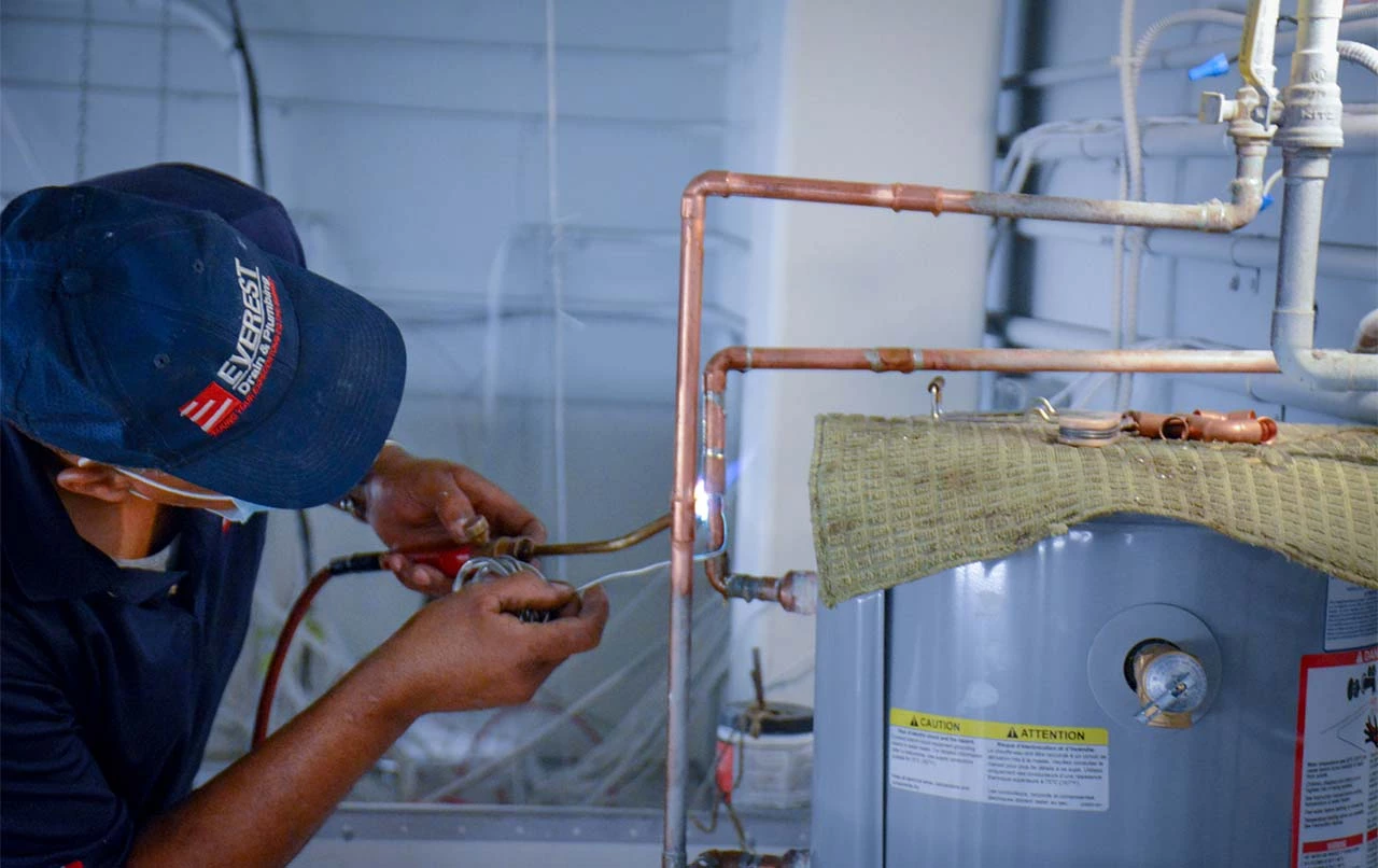 repairing hot water heat by everest prof. plumber